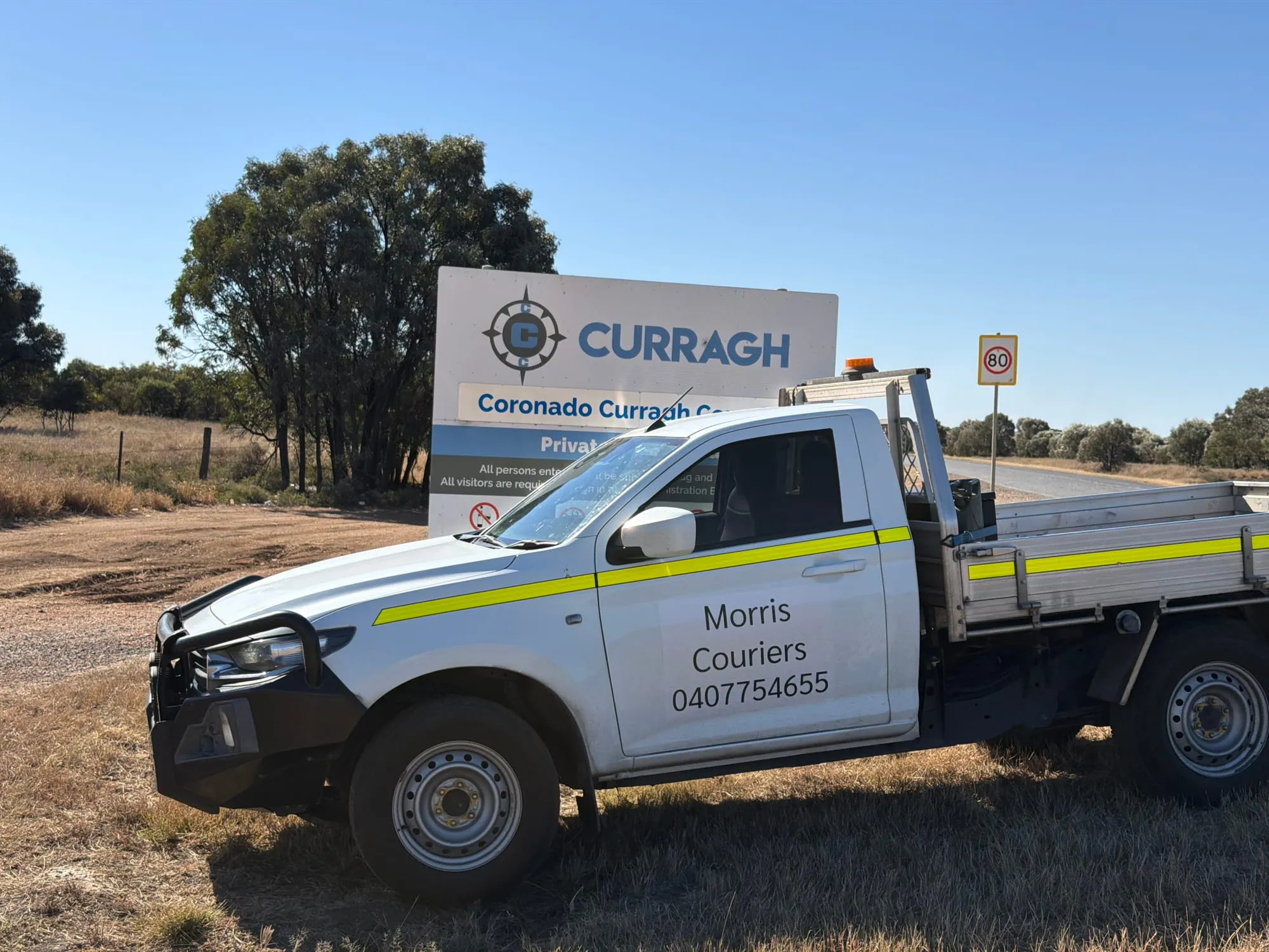 A Morris Couriers ute pulled up at a Central Queensland mine gate.