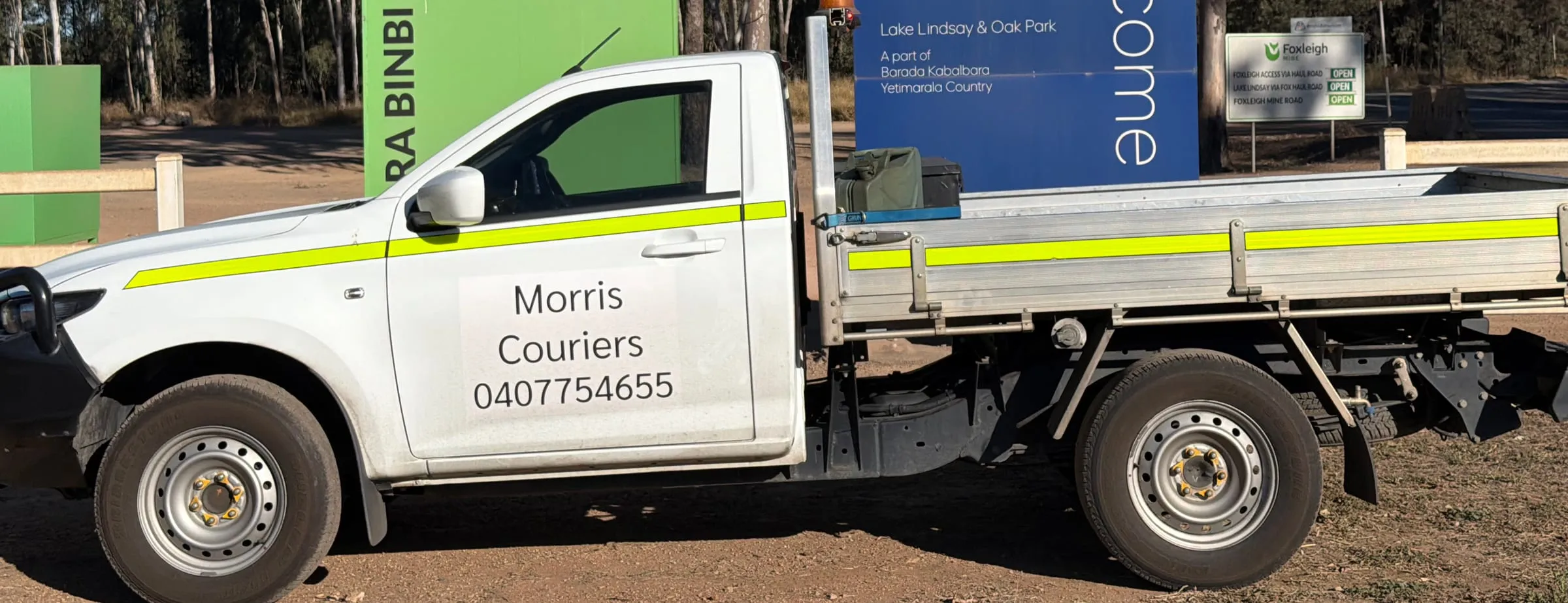 A Morris Couriers ute at a coalfields mine gate west of Mackay.